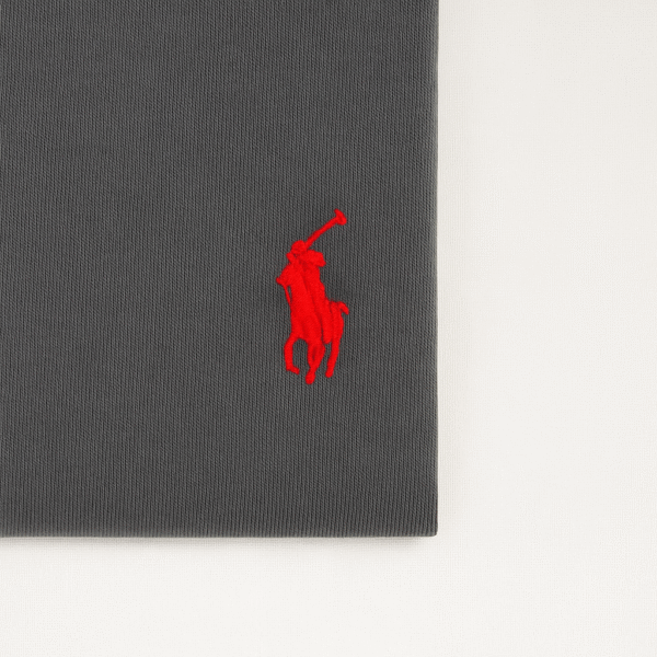 Folded charcoal grey Ralph Lauren t-shirt with red embroidered polo player logo