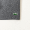 Folded charcoal grey Lacoste T-shirt with embroidered green crocodile logo on the chest