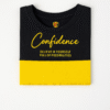 Kids color-block T-shirt in black and yellow with “Confidence” text printed on front