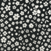 Black floral print tapered pants for girls aged 5 to 6 years with white flower patterns