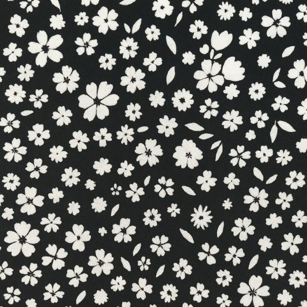 Black floral print tapered pants for girls aged 5 to 6 years with white flower patterns