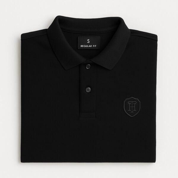 Man wearing premium black polo shirt with HERANGS logo – export quality