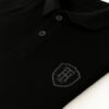 Man wearing premium black polo shirt with HERANGS logo – export quality
