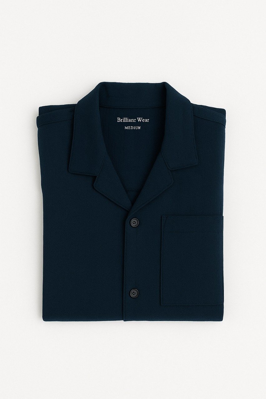 Man wearing export quality navy blue button-down shirt with front pocket and classic collar