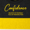 Kids color-block T-shirt in black and yellow with “Confidence” text printed on front
