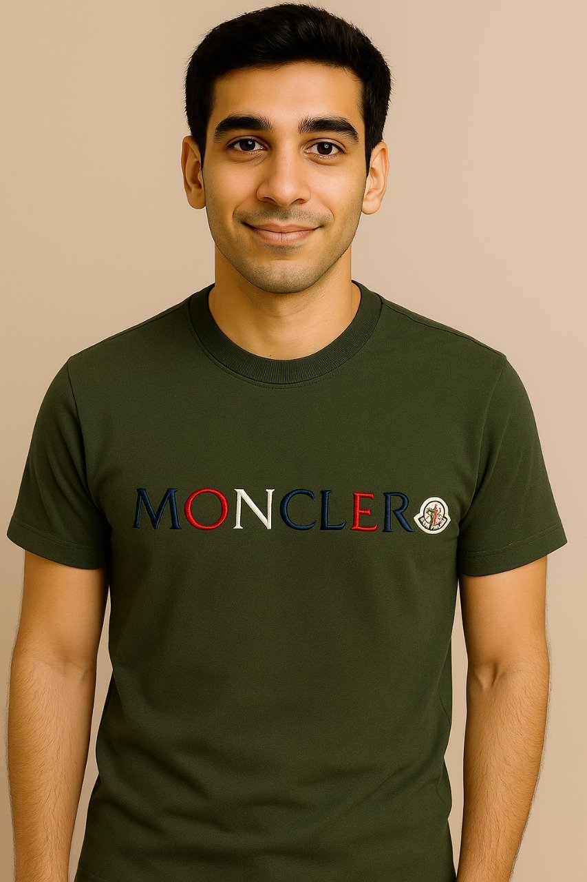 Close-up of Moncler logo embroidered on olive green textured t-shirt fabric