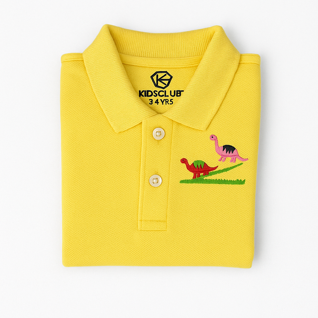 Folded yellow kids polo shirt with dinosaur embroidery and KidsClub branding