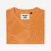 Man wearing an orange tropical leaf print round neck t-shirt