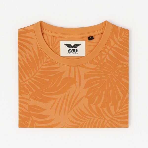 Man wearing an orange tropical leaf print round neck t-shirt