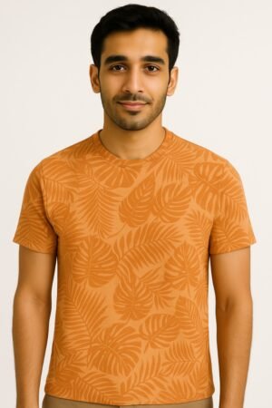 Man wearing an orange tropical leaf print round neck t-shirt
