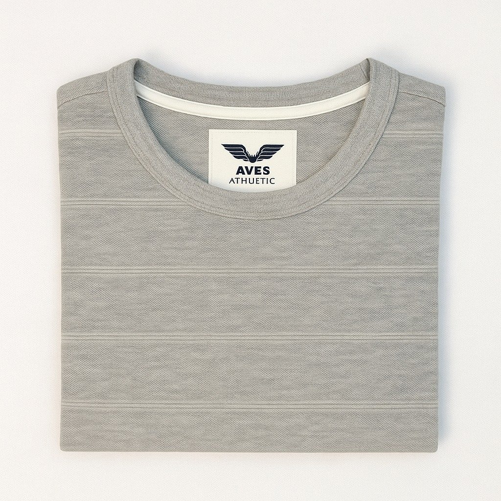 Man wearing a plain light grey melange crewneck T-shirt with short sleeves