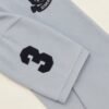 Folded light blue polo shirt with embroidered "Limited Edition Since 1968" crest on chest