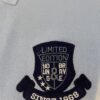 Folded light blue polo shirt with embroidered "Limited Edition Since 1968" crest on chest
