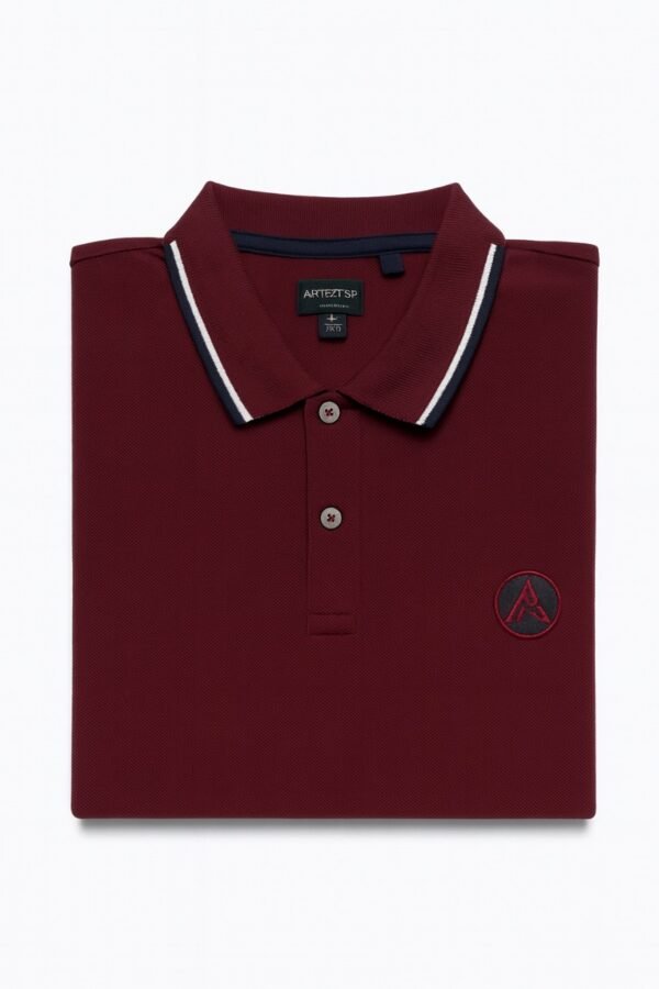 Burgundy polo shirt with white and navy collar trim and embroidered "A" logo on chest.