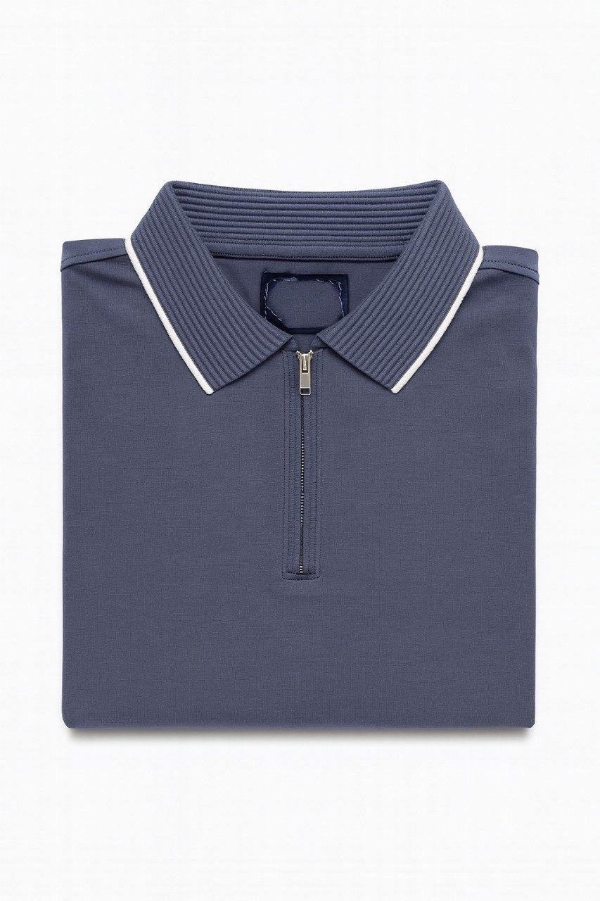 Folded navy blue polo shirt with ribbed collar, white trim, and front zipper on a white background.
