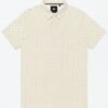 Short-sleeved off-white polo shirt with gold geometric print laid flat on white background.