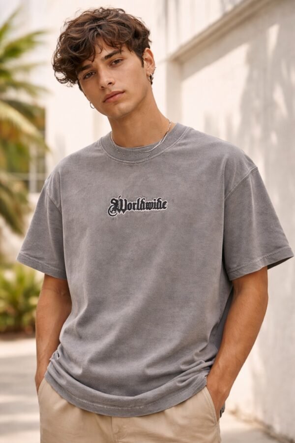 a light grey oversized half-sleeve t-shirt with “Worldwide” text logo printed in the center on the front.