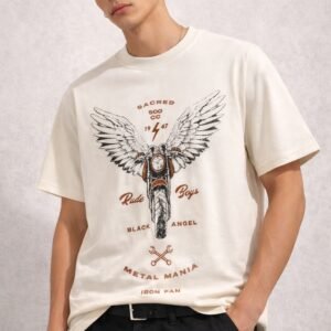 Male model wearing a beige oversized half-sleeve t-shirt with a vintage motorcycle and wings graphic print on the front.