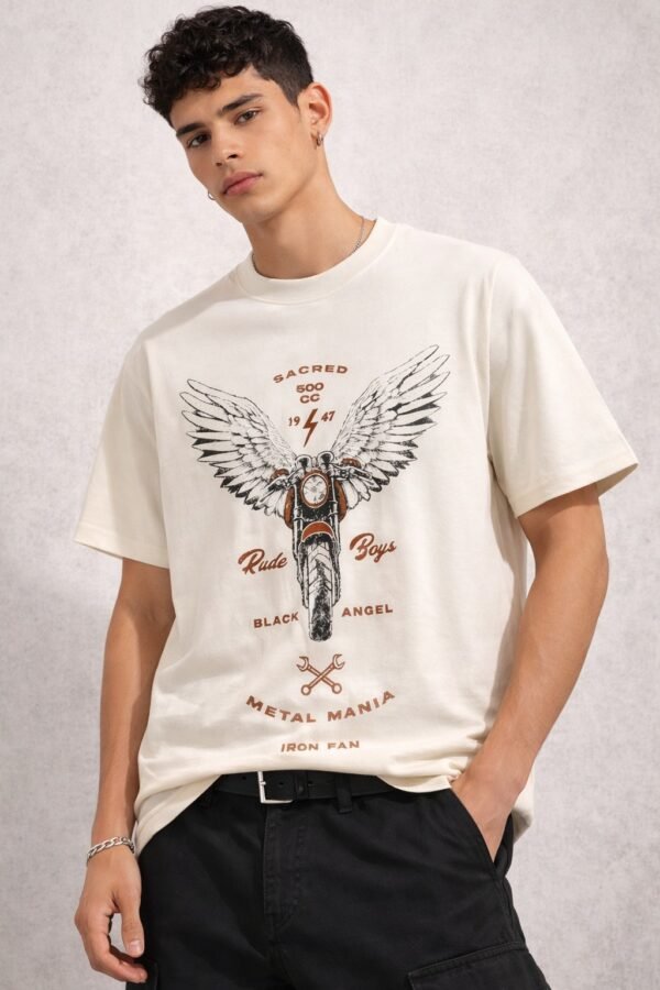 Male model wearing a beige oversized half-sleeve t-shirt with a vintage motorcycle and wings graphic print on the front.