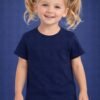 Young girl model wearing a navy blue plain kids t-shirt with denim shorts on a studio blue background.