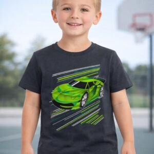 Young boy model wearing a charcoal grey sports car graphic kids t-shirt with dark trousers on an outdoor basketball court background.