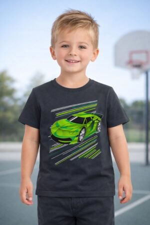 Young boy model wearing a charcoal grey sports car graphic kids t-shirt with dark trousers on an outdoor basketball court background.