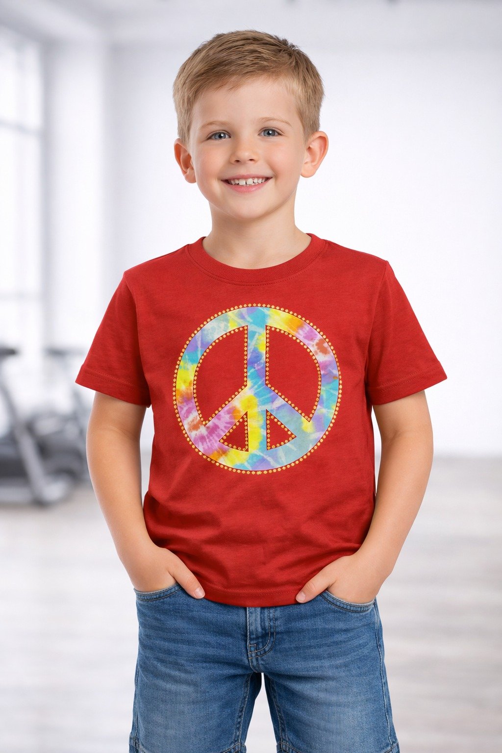 Young boy wearing a red half sleeve t-shirt with colorful peace symbol graphic
